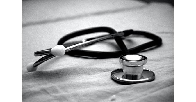 A black and white photo of a stethoscope. 